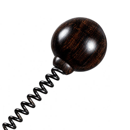 Rounded ball head detail of purple ebony spring spanking mallet