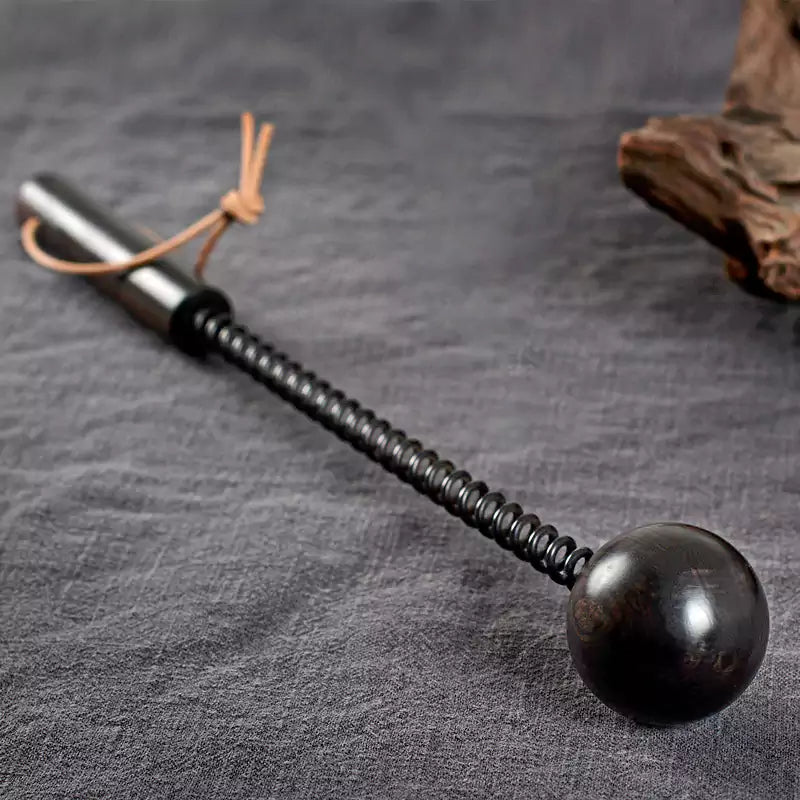 Purple ebony spring spanking mallet displayed in a lifestyle setting
