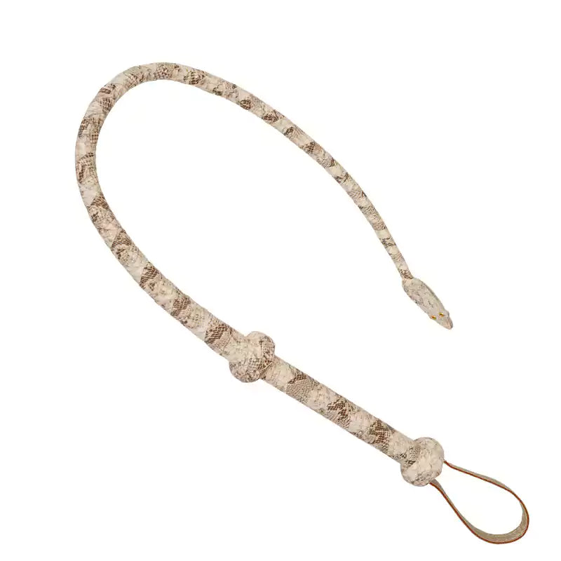 angled display of handcrafted leather whip showing raised knot handle and wrist strap