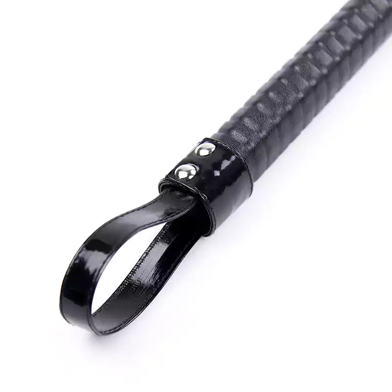 Close-up of seven-color handle on eight-rod rattan discipline cane