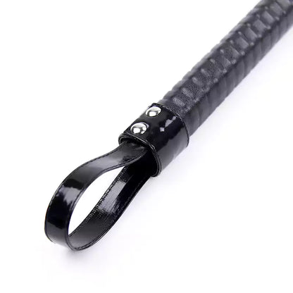 Close-up of seven-color handle on eight-rod rattan discipline cane