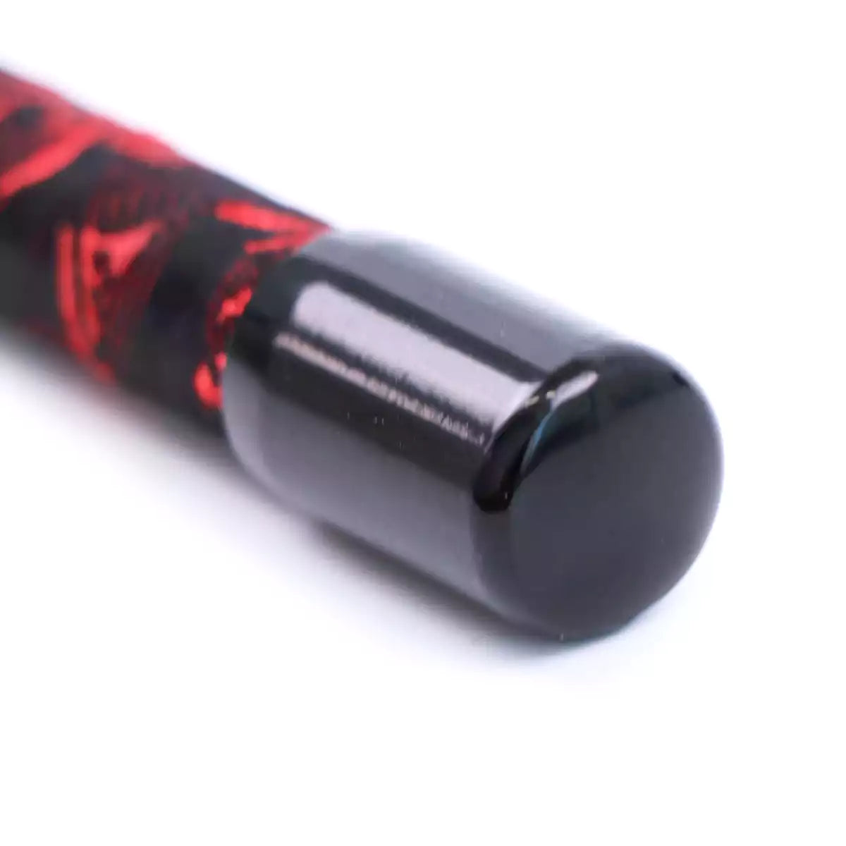 Close-up of anti-slip handle on red Chinese embroidered riding crop