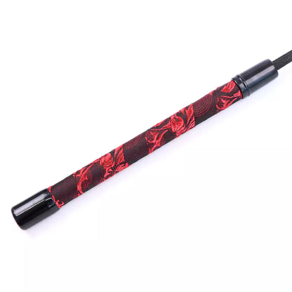 Second close-up of handle on red Chinese-style BDSM riding crop