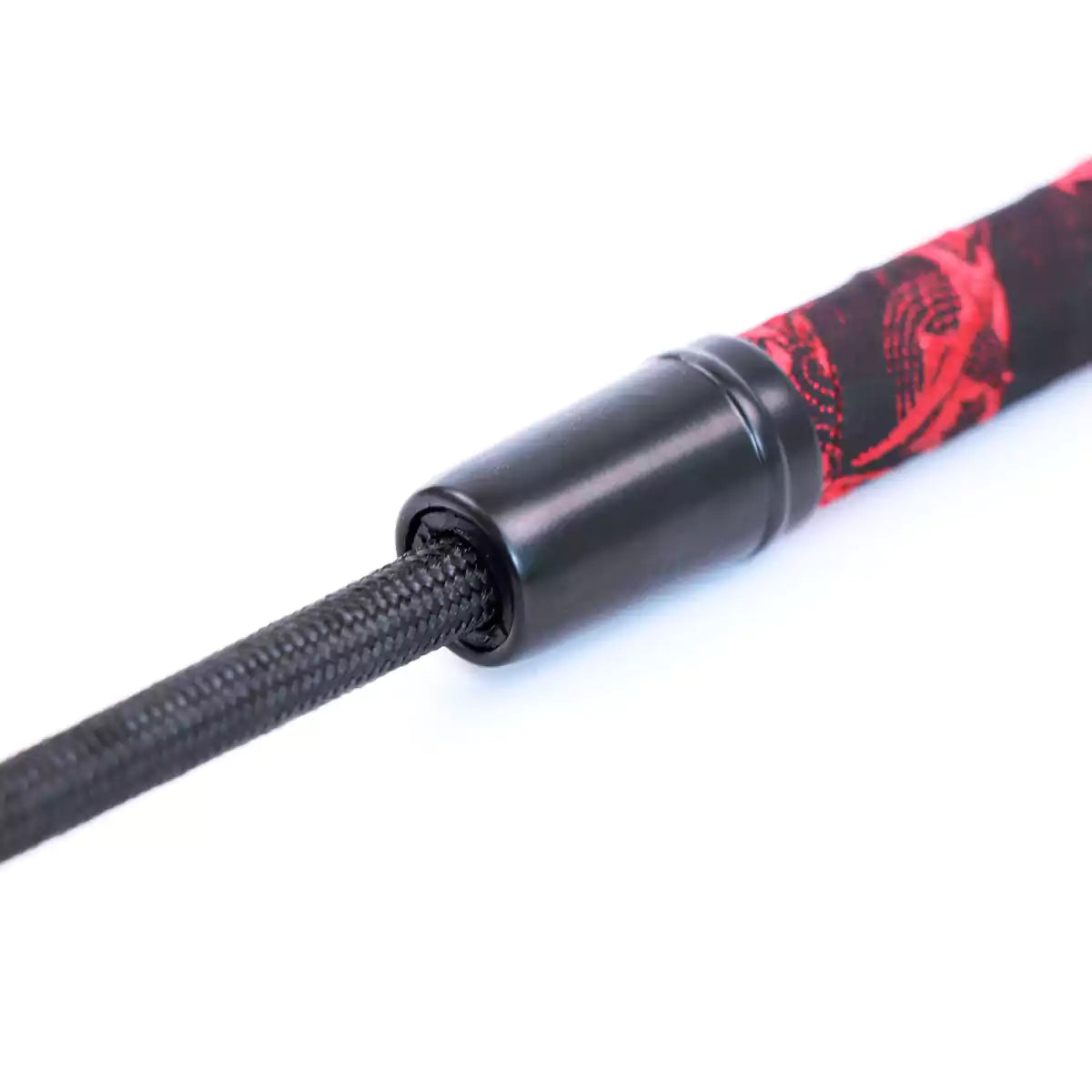 Close-up of shaft connection on red Chinese-style riding crop