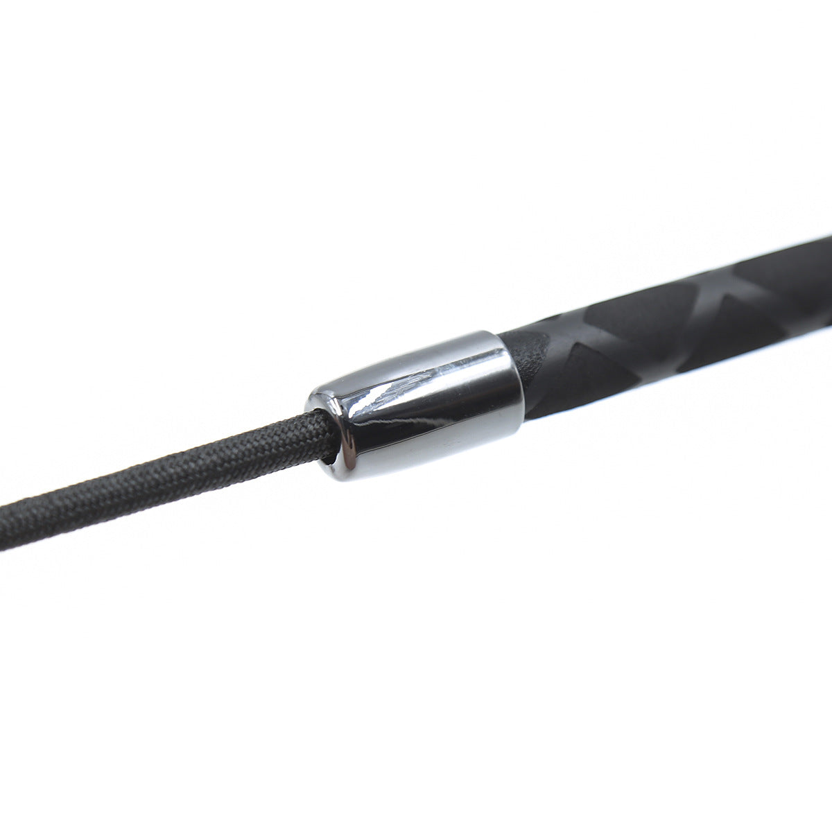 Close-up detail of the handle on the red heart riding crop