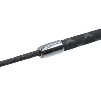 Close-up detail of the handle on the red heart riding crop
