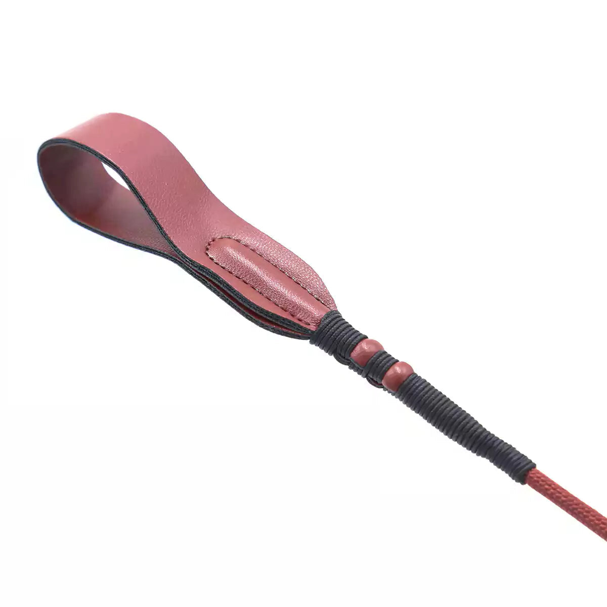 Close-up of slim faux leather striking tip on red long riding crop