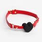 Red strap with black heart silicone gag full view