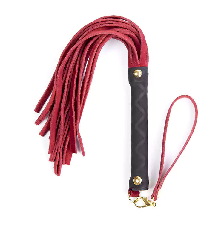 red multicolor suede BDSM flogger showing soft falls and compact short-range design