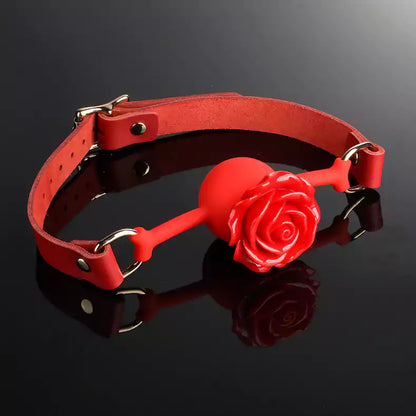 Rose silicone ball gag shown in a soft editorial product setting
