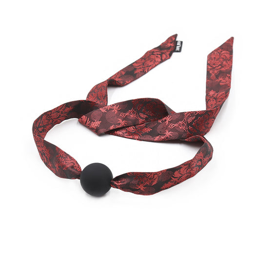 front view of silk ribbon silicone ball gag with flowing patterned tie
