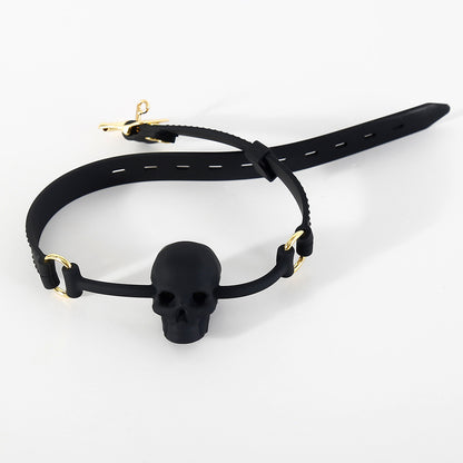Black silicone BDSM ball gag with vented skull mouthpiece displayed on a clean white background