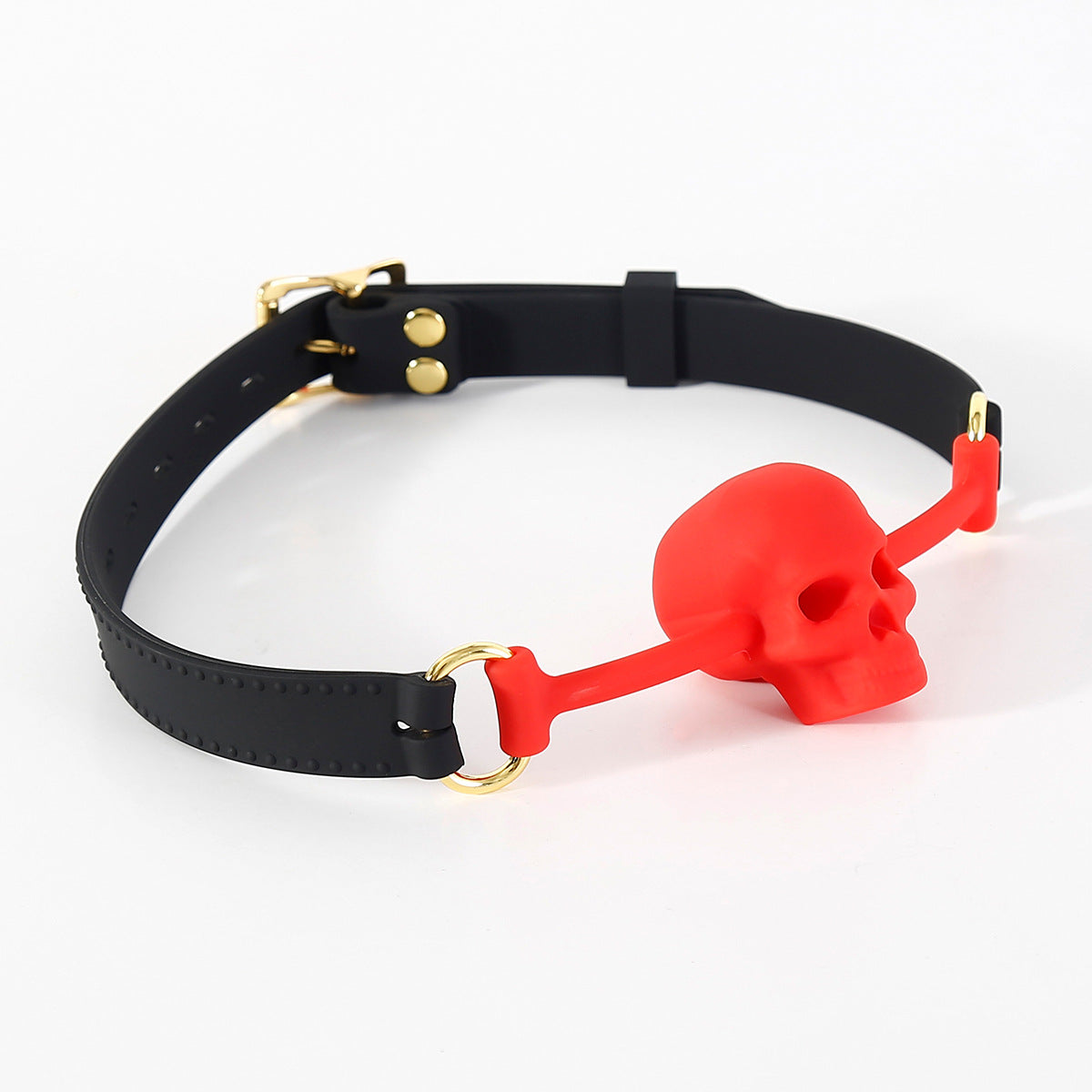Close-up detail of the vented skull-shaped silicone mouthpiece on the BDSM ball gag
