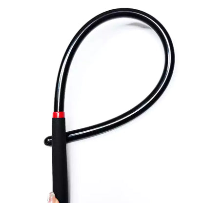 Black soft acrylic flexible discipline cane bent showing flexibility