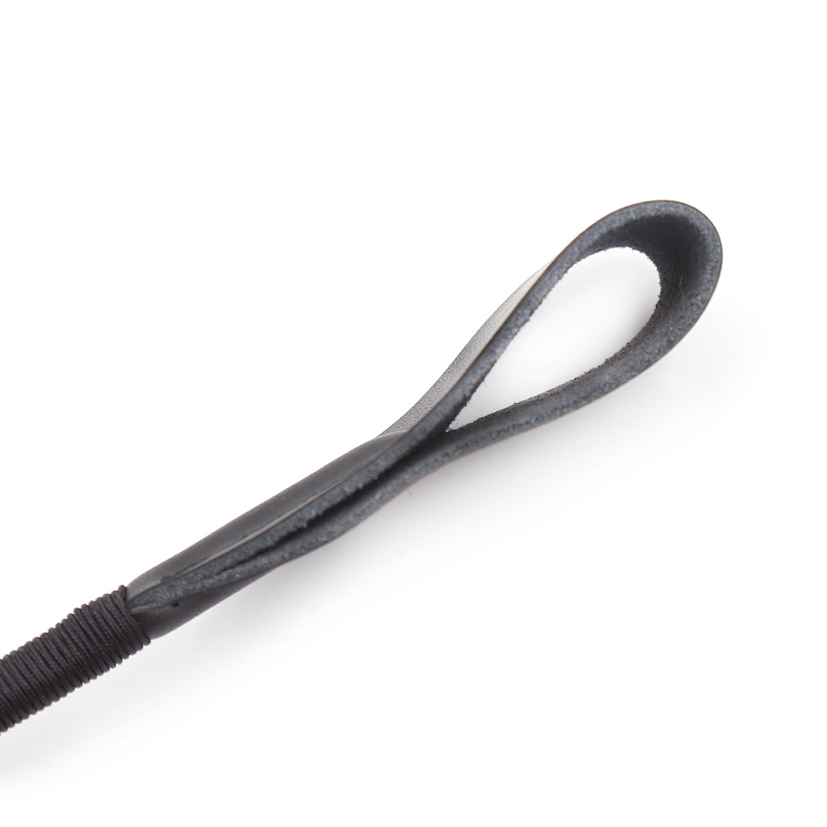 Side close-up of the stitched striking tip on the riding crop with braided black handle