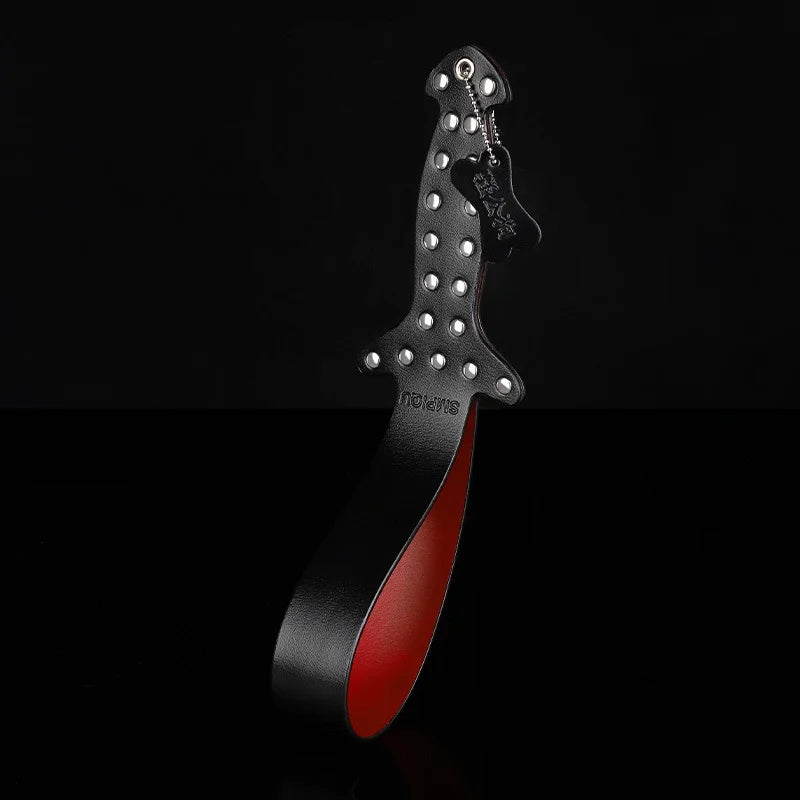 Close-up of studded leather handle grip