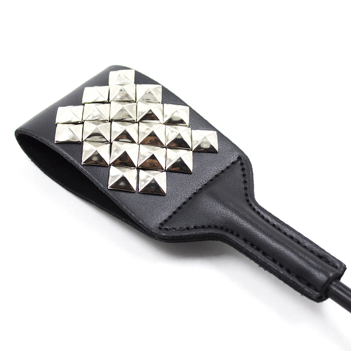 Close-up of full stud pattern on riding crop striking face