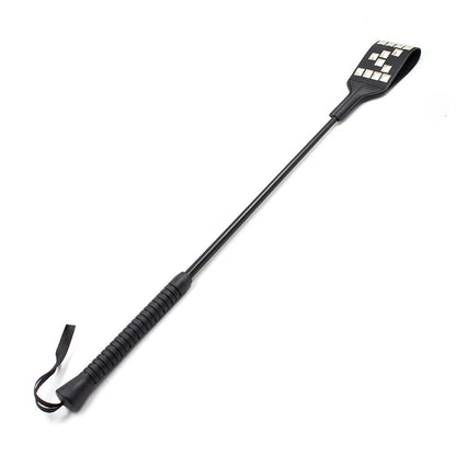 Studded riding crop with rubber handle full view showing faux leather face
