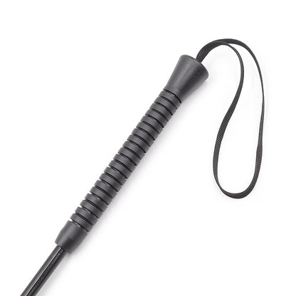 Close-up of rubber non-slip handle on studded BDSM riding crop