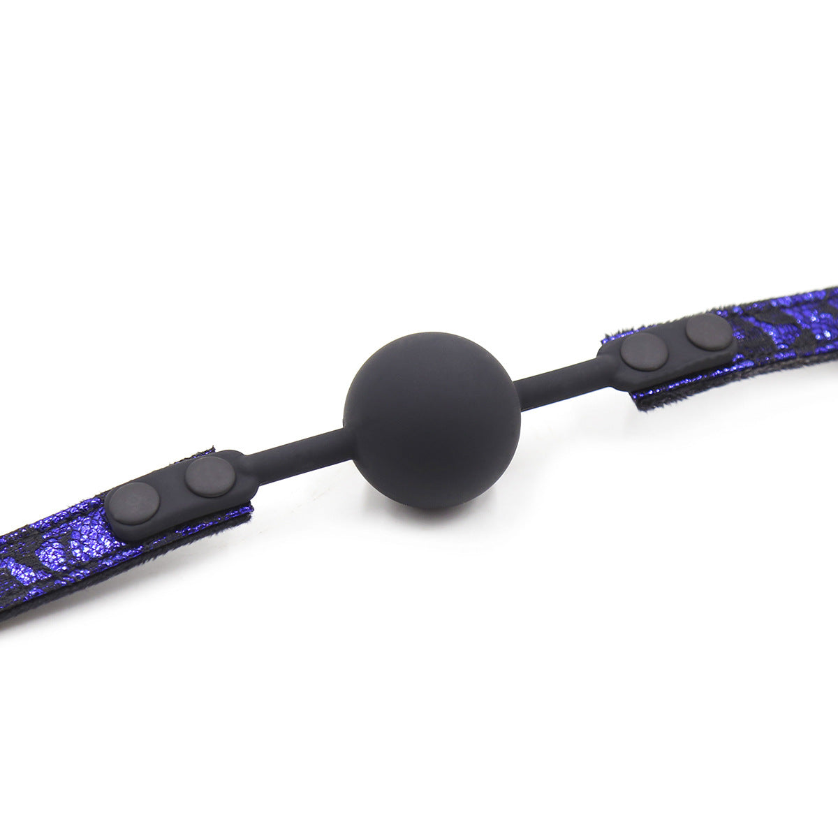 Close-up detail of the silicone ball and plush suede inner strap on the ball gag