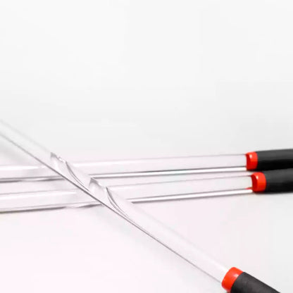 Transparent acrylic discipline cane full view on white background