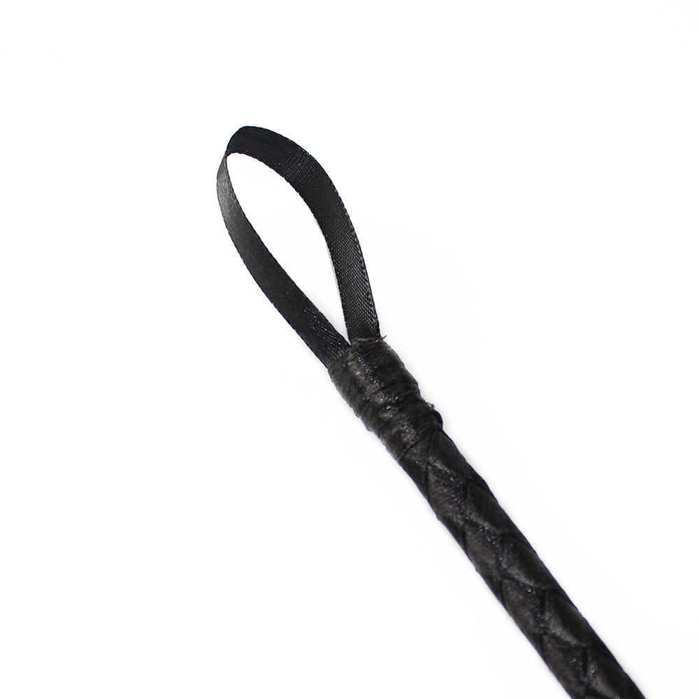 Close-up of striking tip on vintage braided BDSM cane