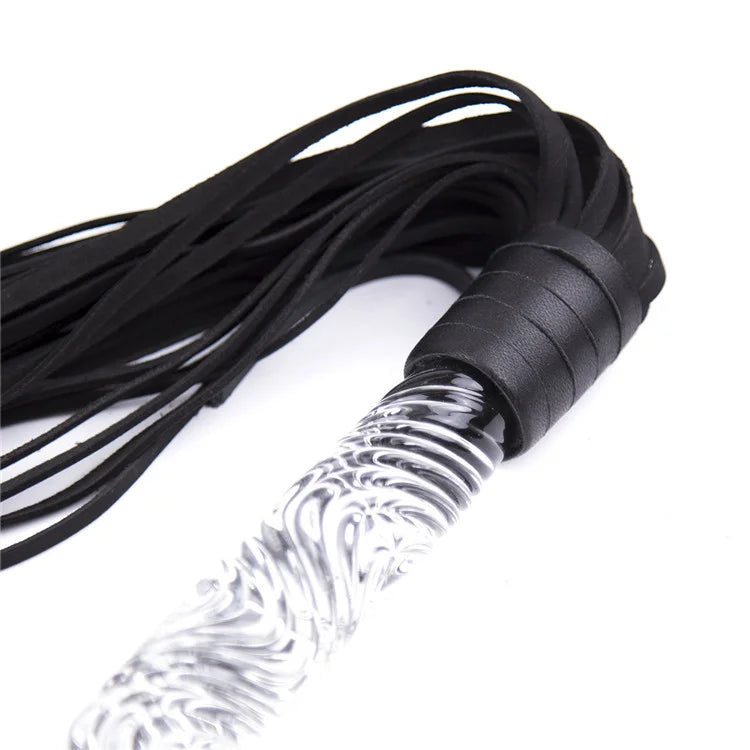 Close-up of wave-textured glass handle on leather flogger
