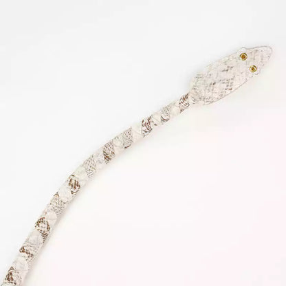 close-up of whip tip and python embossed leather texture showing striking precision