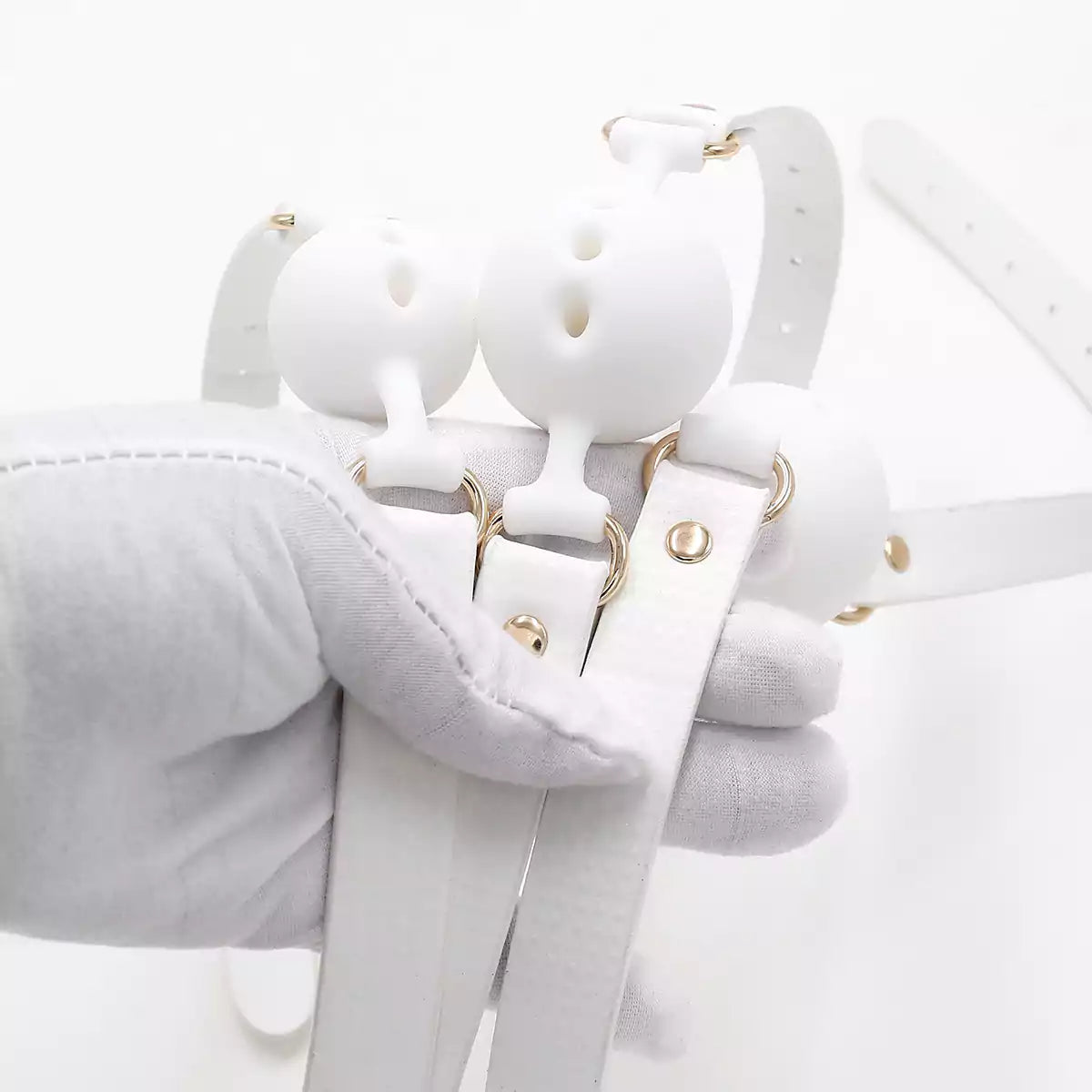 Additional close-up of the white breathable ball gag design