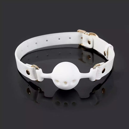 White breathable ball gag featured in an atmospheric product scene