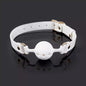 White breathable ball gag featured in an atmospheric product scene