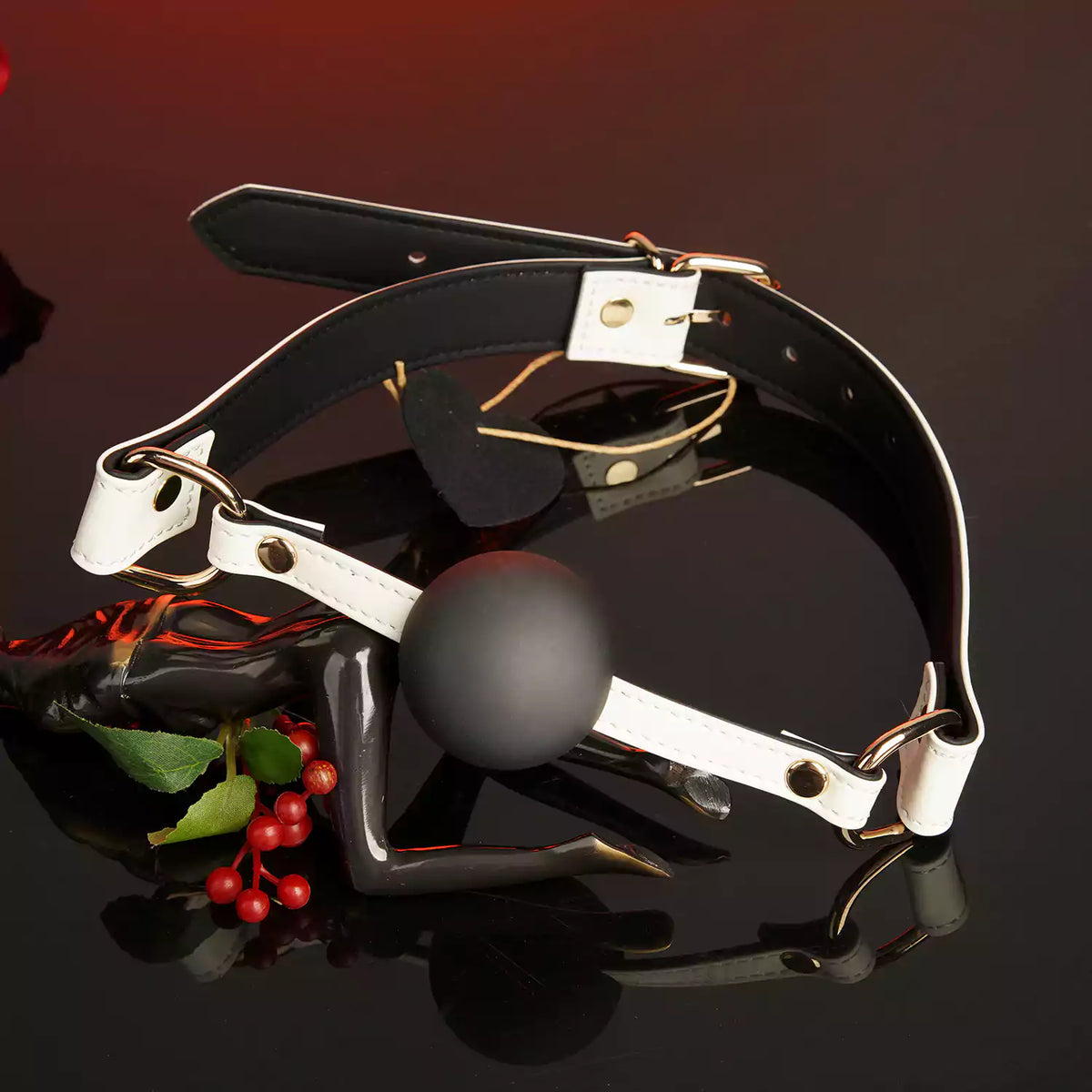 Close-up detail of the white leather ball gag and genuine leather strap