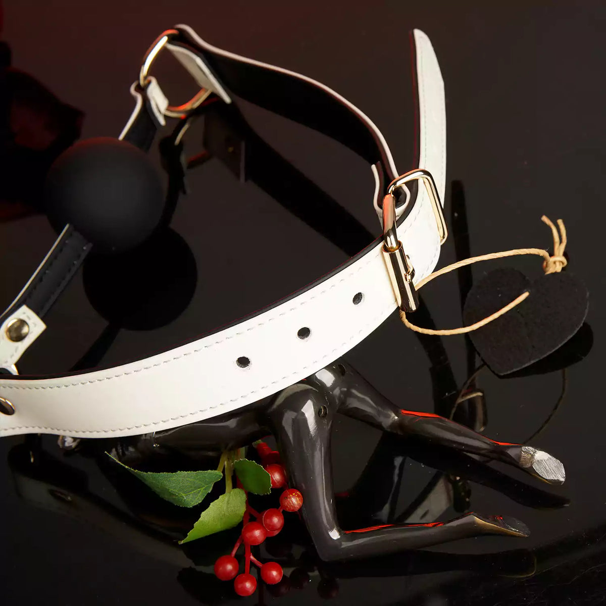 Detailed view of the handcrafted white genuine leather strap on the ball gag