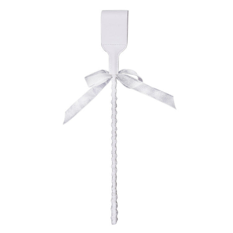 Back view of white studded ribbon riding crop showing reverse head