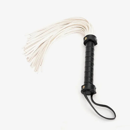 full view of white suede flogger with black anti-slip handle