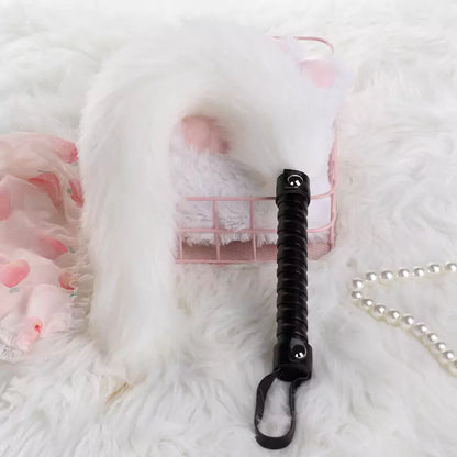 White faux fur tail with black handle detail