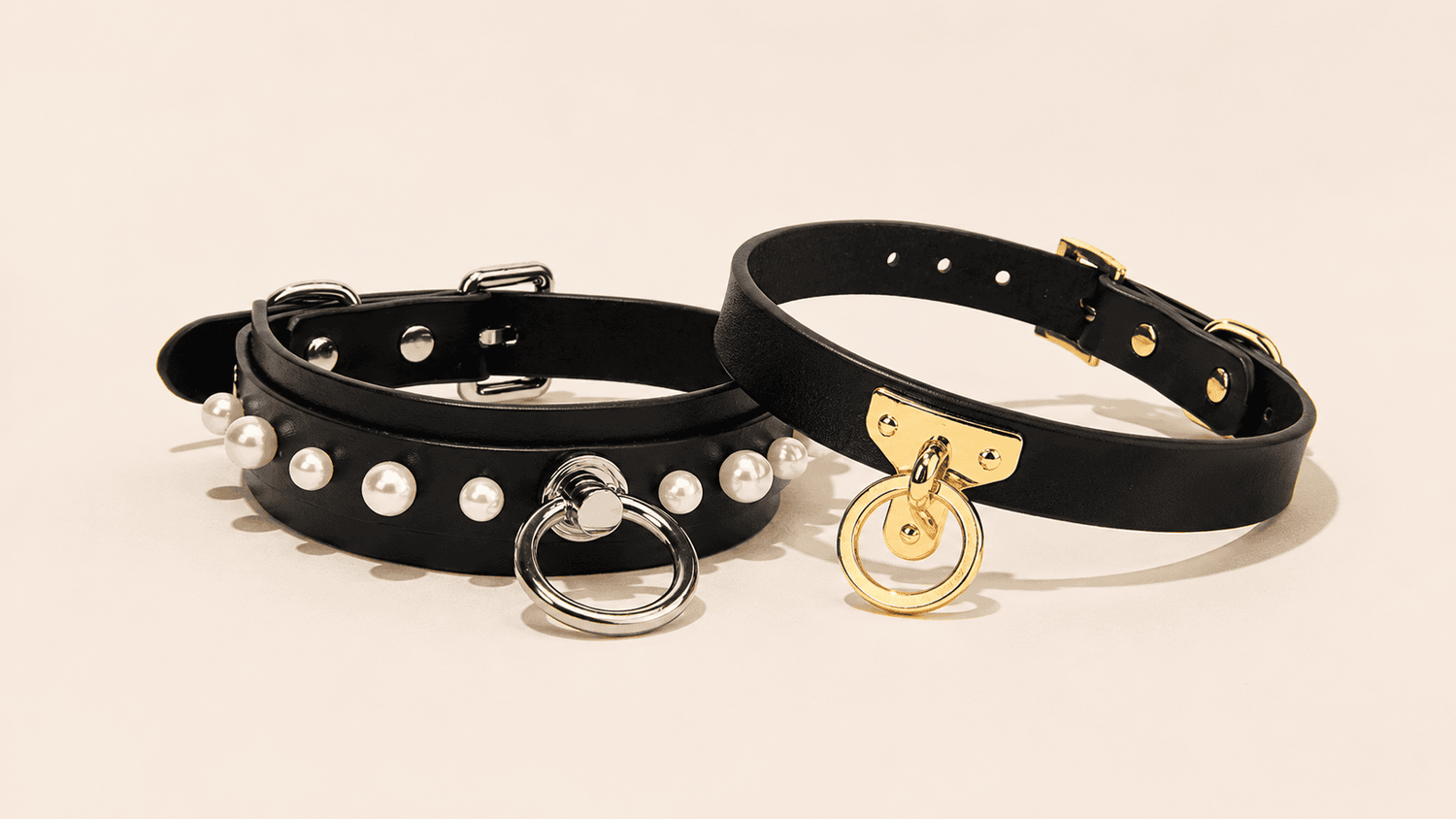 Bondage collar with leather body, metal hardware, and reinforced structure.