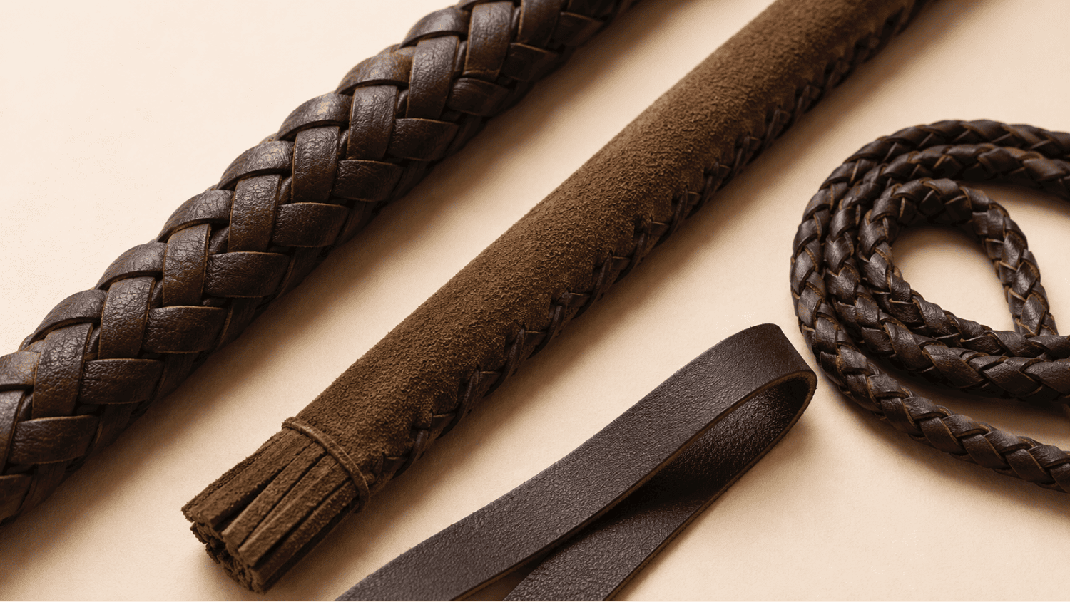 Snake whips with braided leather body, tapered build, and flexible handling.