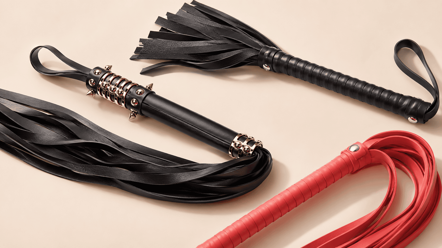 Thuddy floggers with leather and suede tails for dense, cushioned impact.